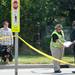 An Ann Arbor police officer speaks with witness after a pedestrian was struck by a car while attempting to cross Plymouth Rd. between Traverwood Dr. and Nixon Rd. on Wednesday, August 7, 2013. Melanie Maxwell | AnnArbor.com 